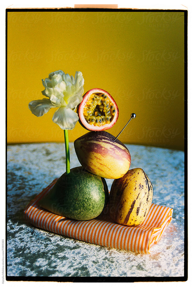 Still life with radish, passion fruit and melon pear.