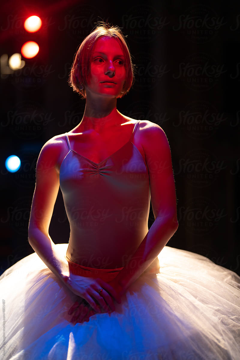 Ballerina standing in studio class in front of the camera