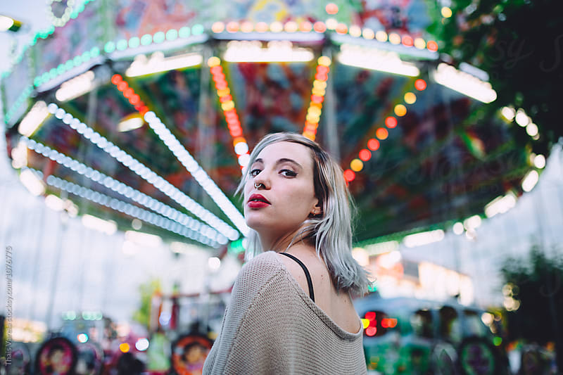 portrait in front of a carrousel
