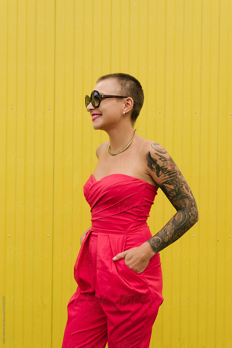Smiling Short-haired Tattoed Girl In Hot Pink Outfit