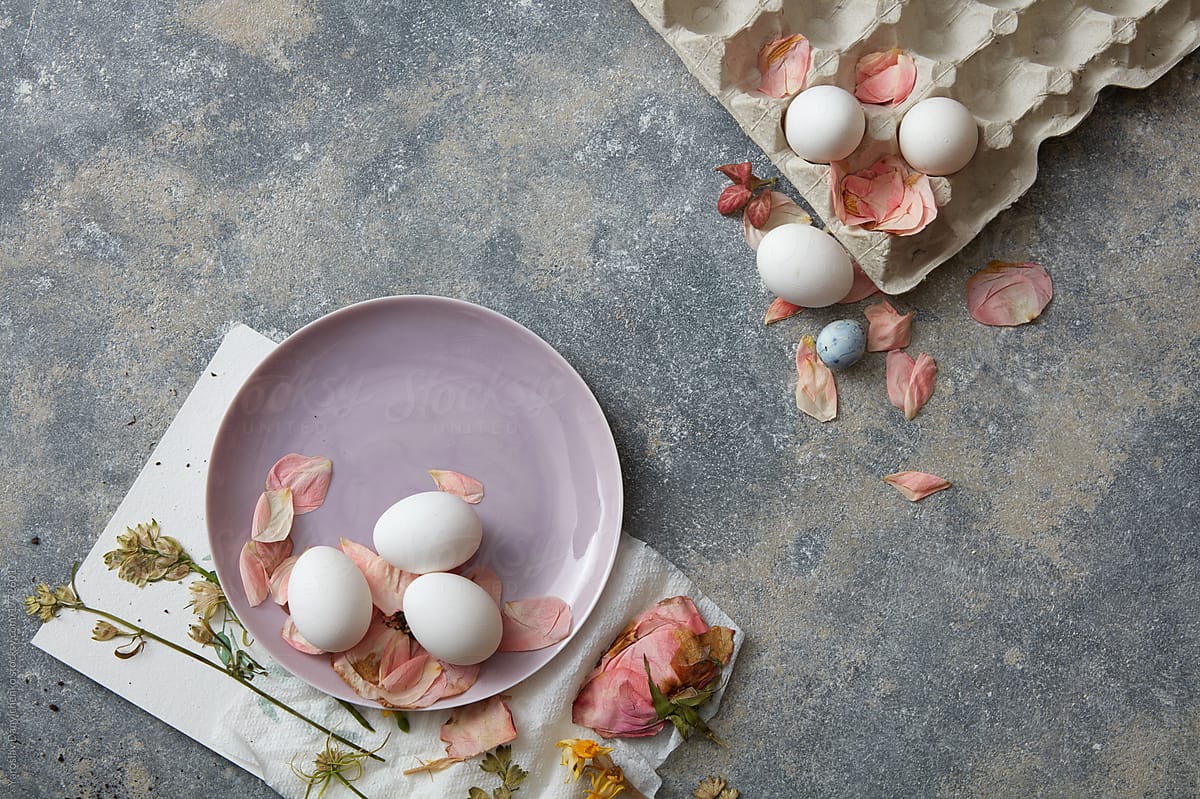 white Easter eggs in a pink plate