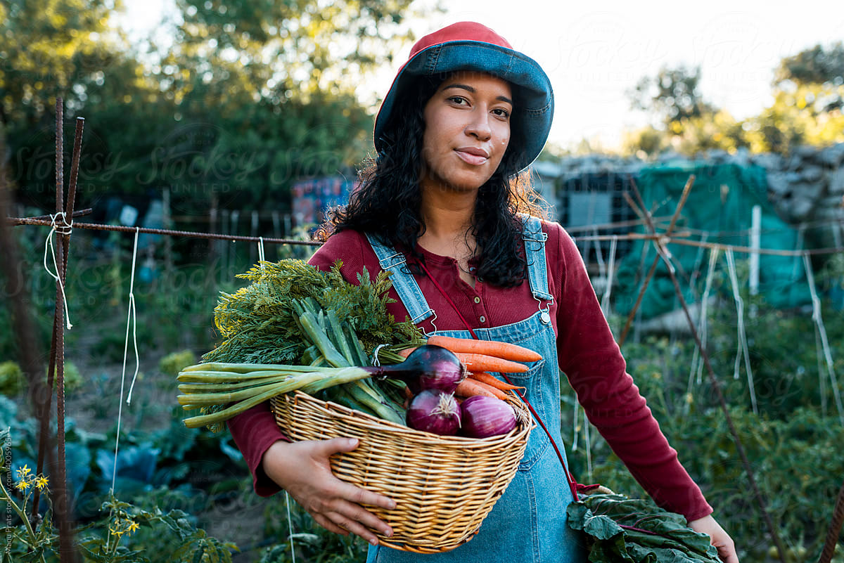 Multiracial woman collecting organic food