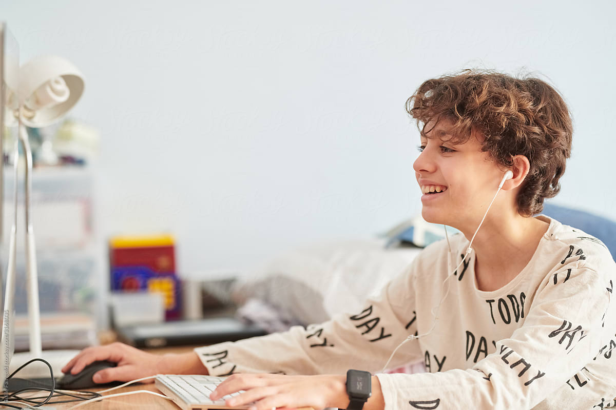 Happy boy using computer