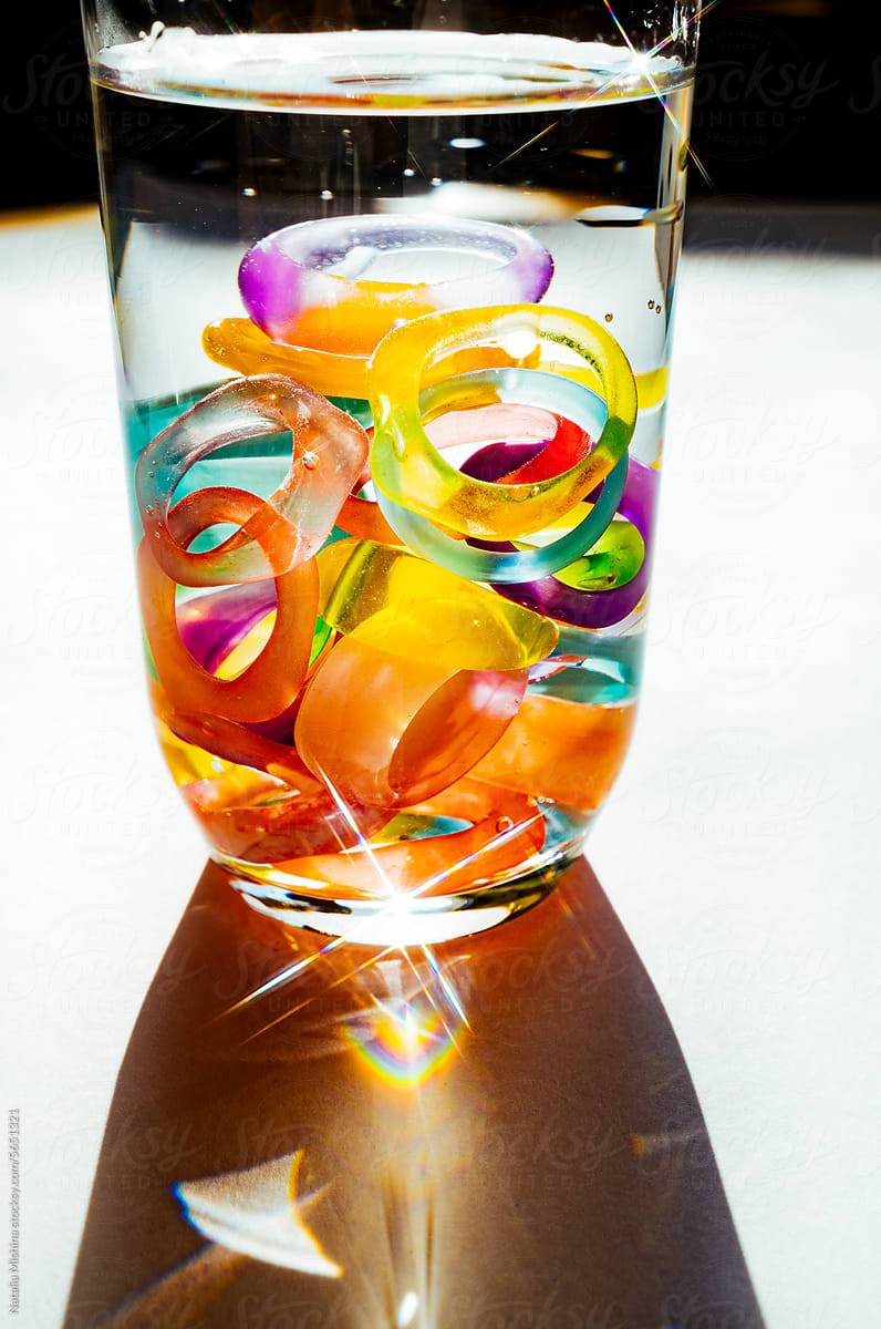 Plastic rings in a glass of water.