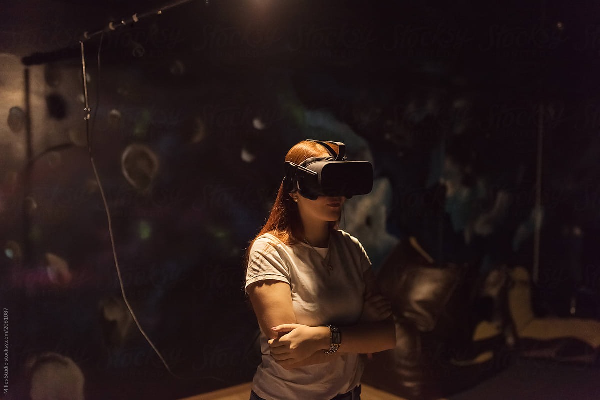 Woman wearing VR glasses in studio