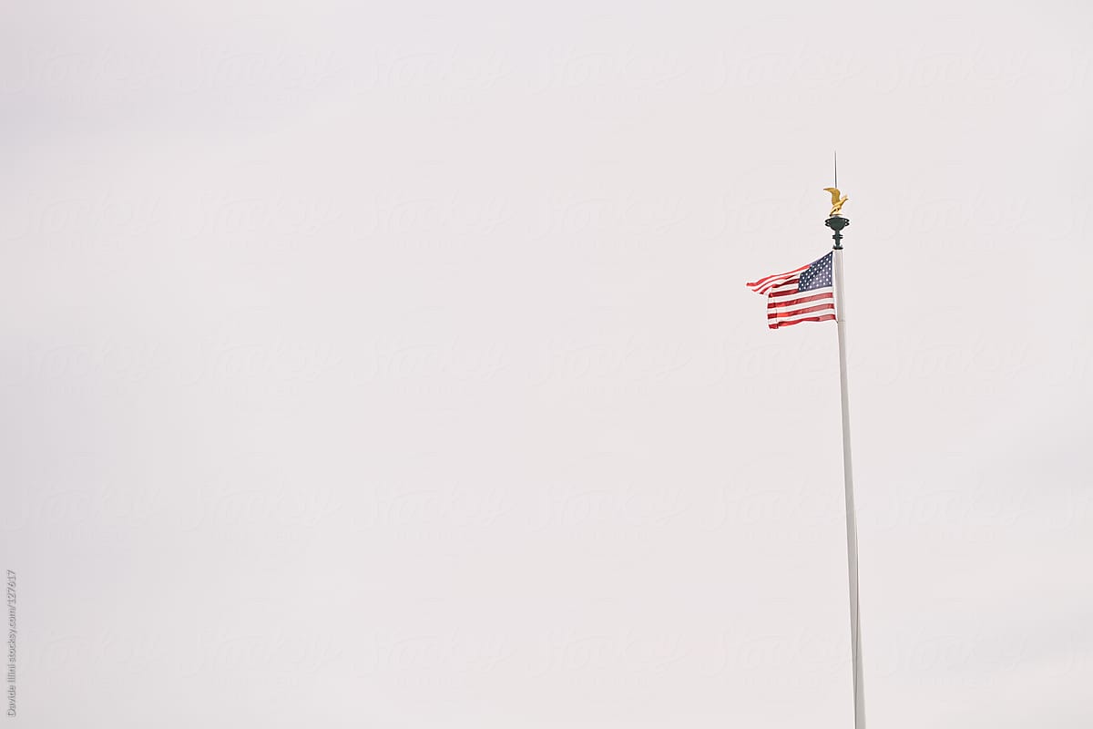 American flag on military cemetery - Omaha Beach, Normandy France.