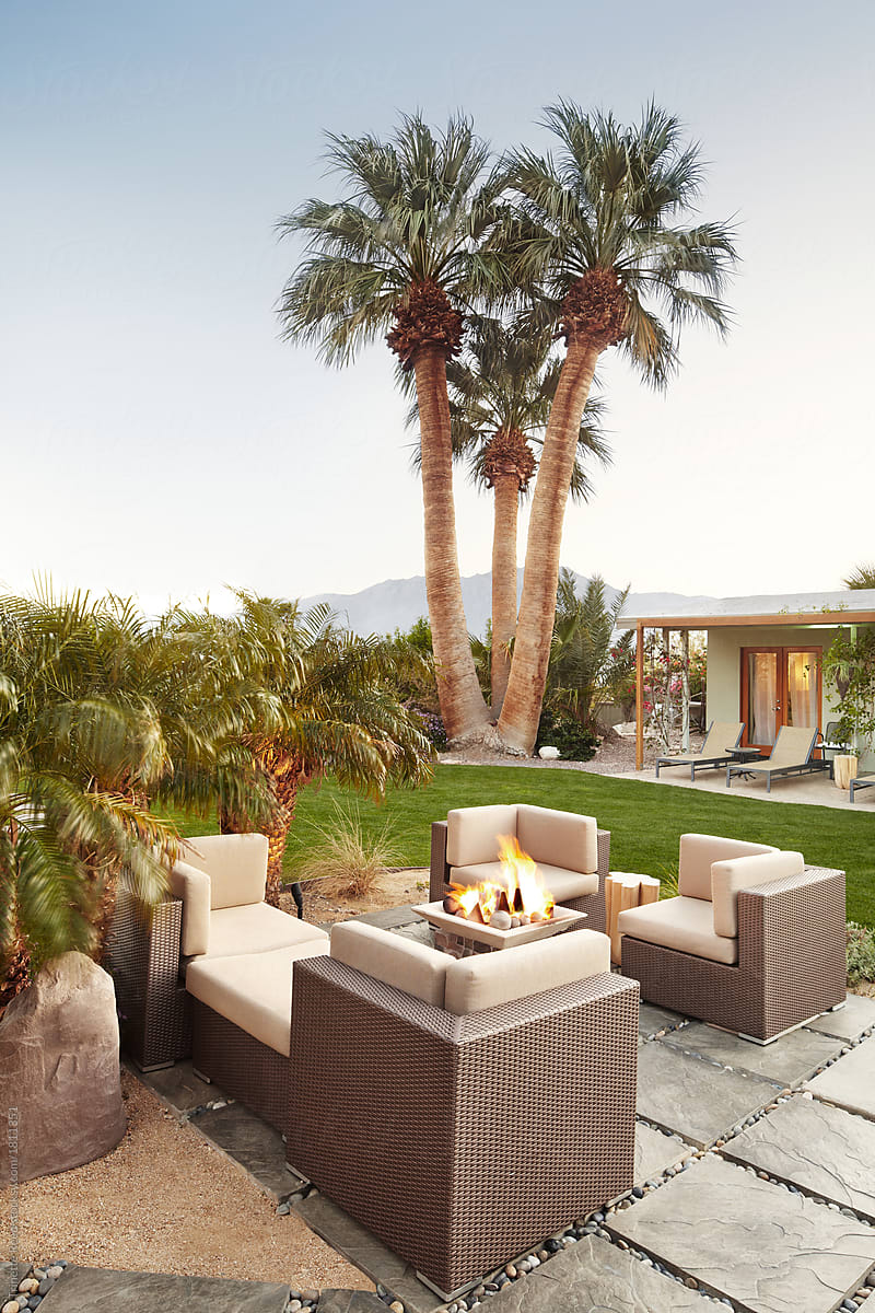 Outdoor lounge with fire pit at luxury hot springs in Palm Springs, California