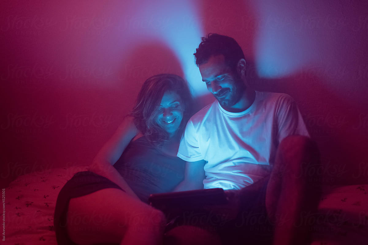 Smiling couple with a tablet