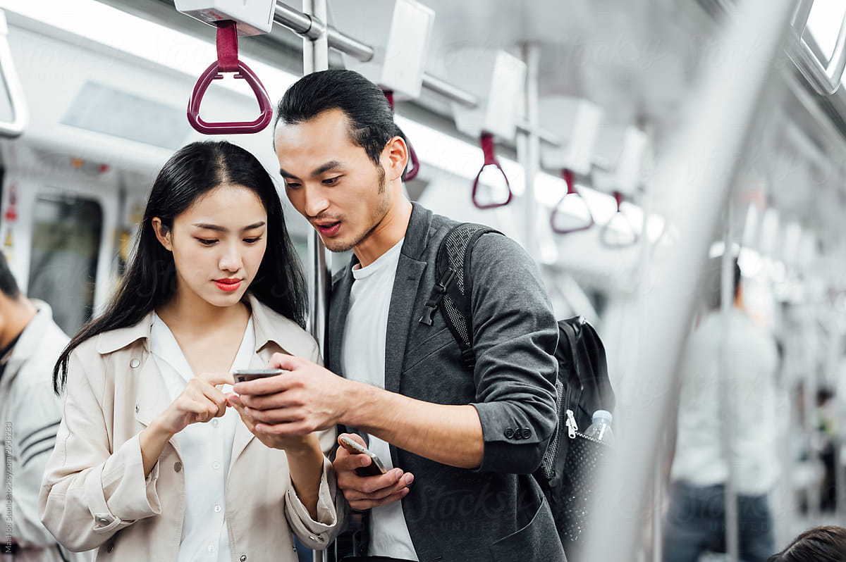 Asian man and woman in the subway