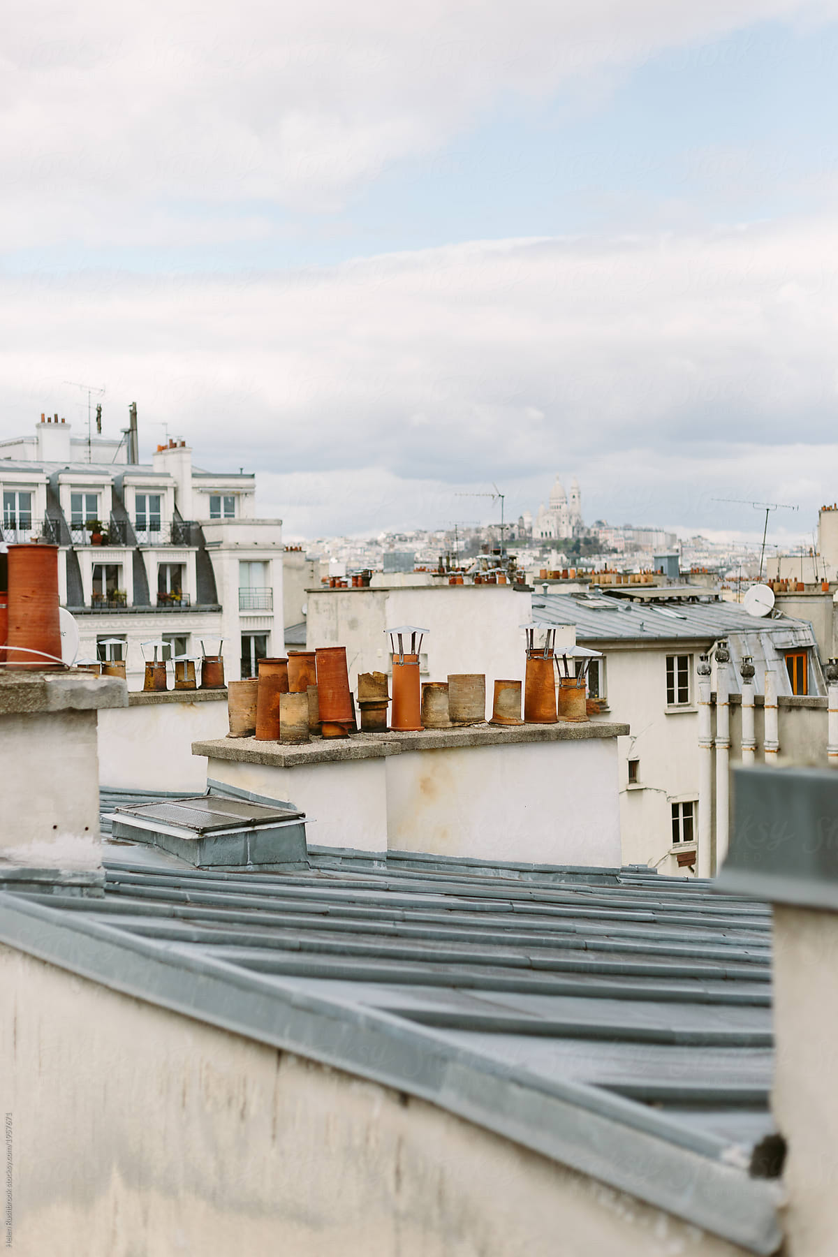 A view across Paris rooftops to the Sacre Coeur in the distance