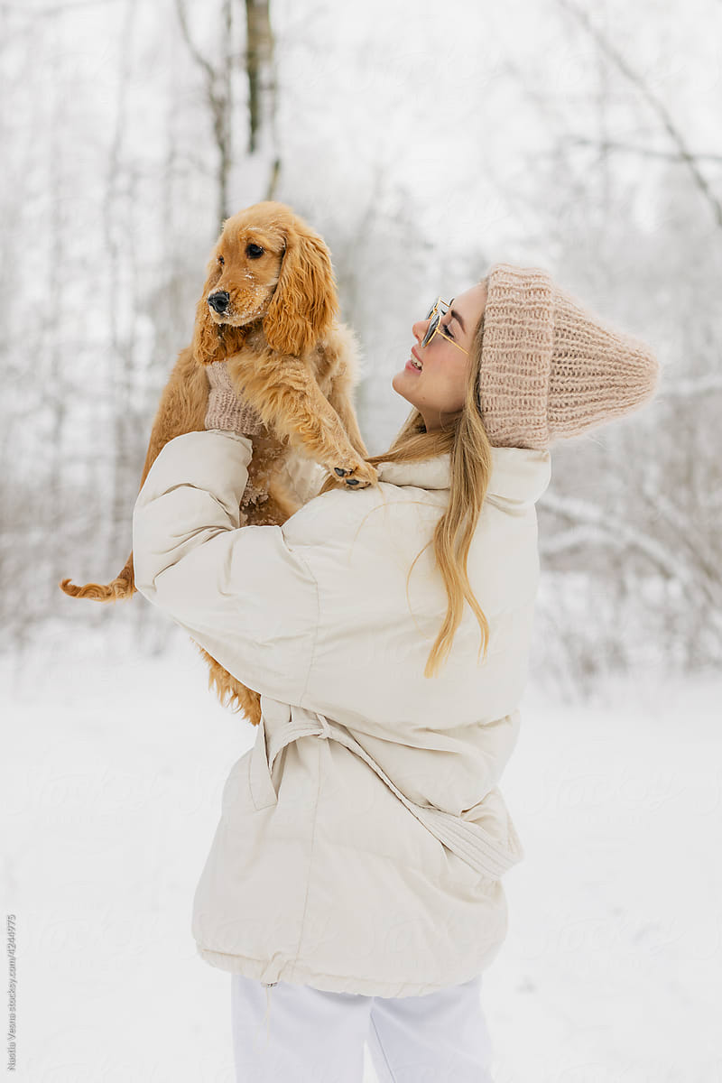 Girl holding a dog