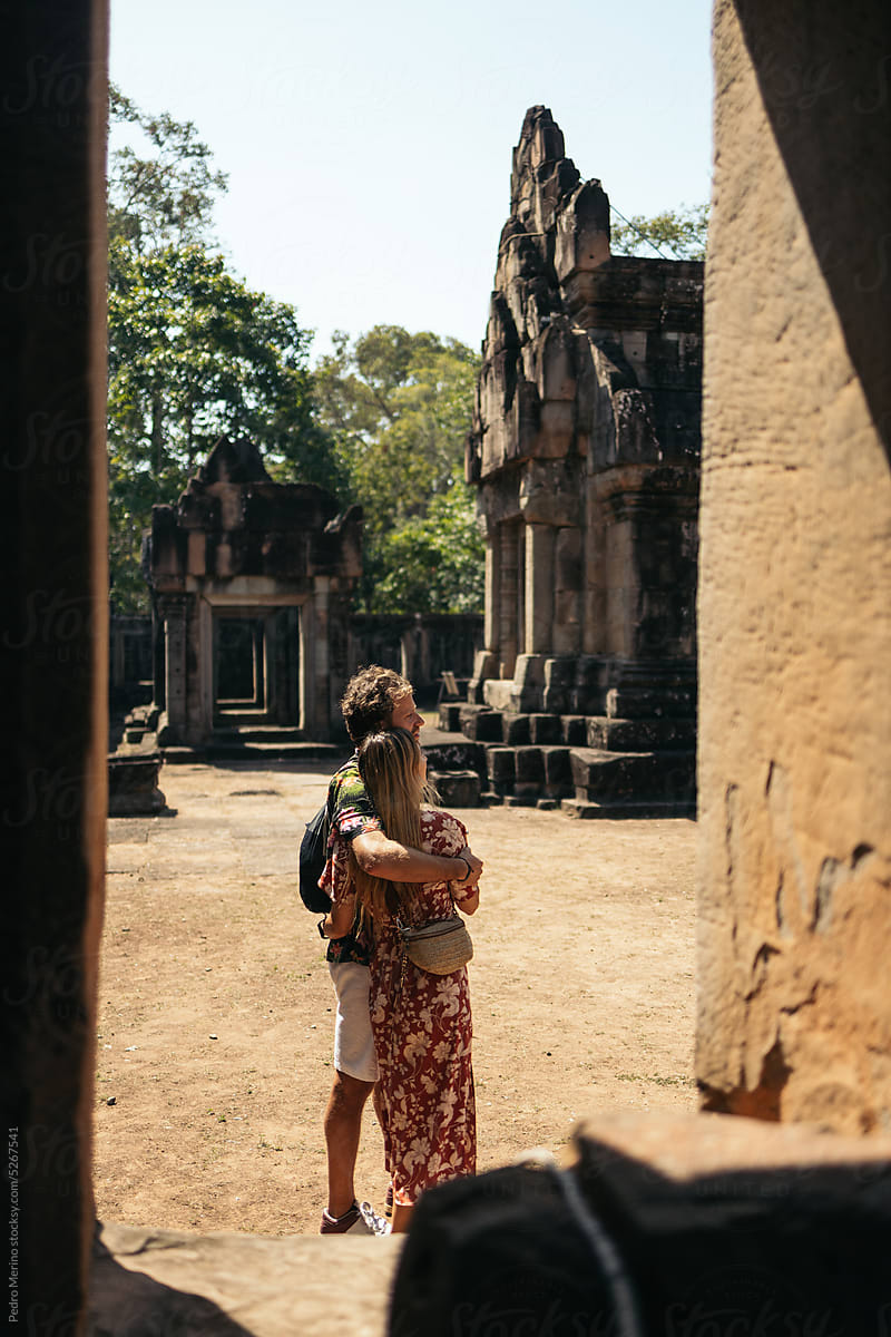 Couple visiting the ruins of the ancient temples of Angkor