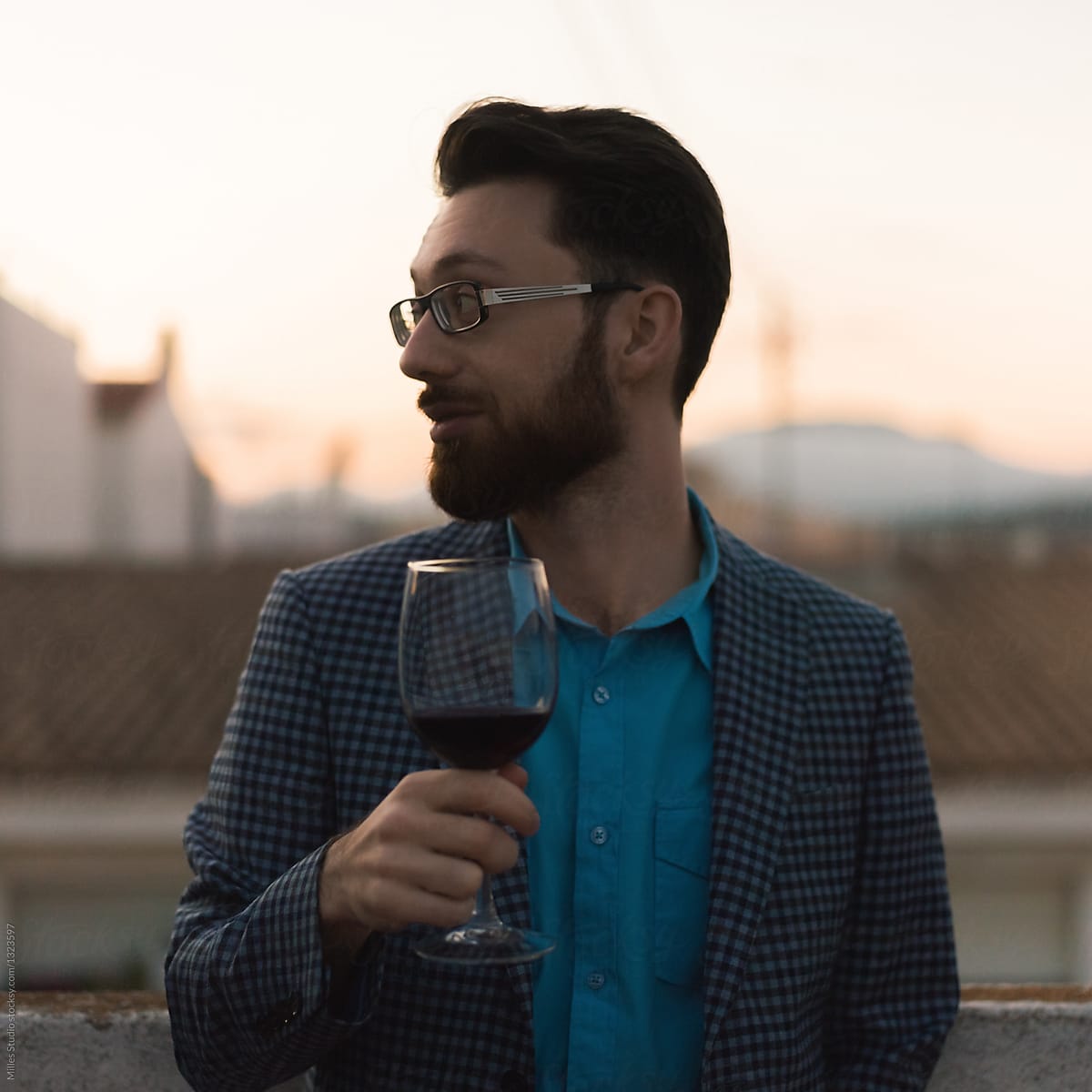 Handsome man holding the wine