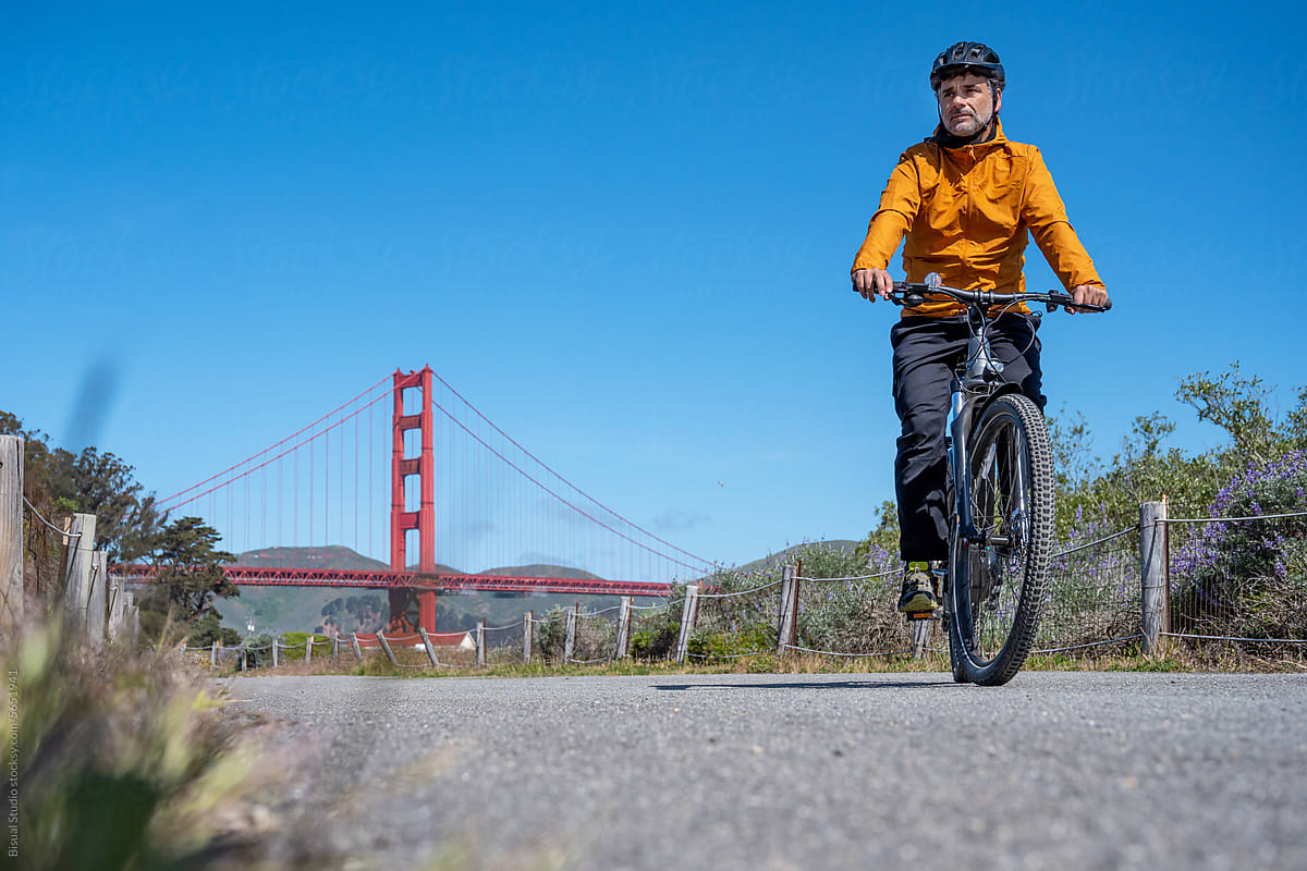 Tourist man riding a bike in San Francisco