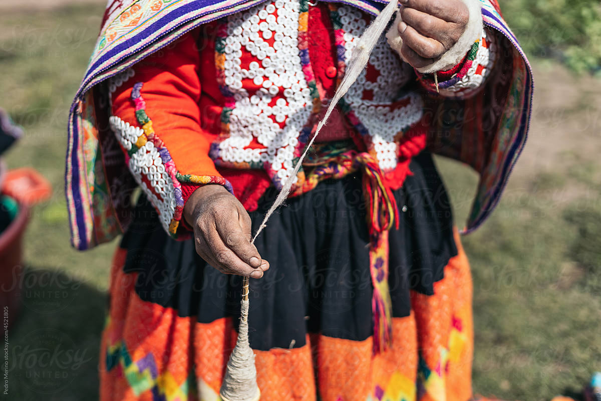 Unrecognizable Woman Threading Wool In Peru