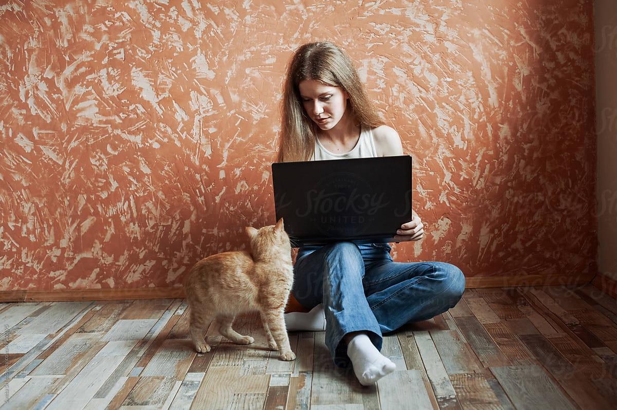 Young blonde woman and her cat