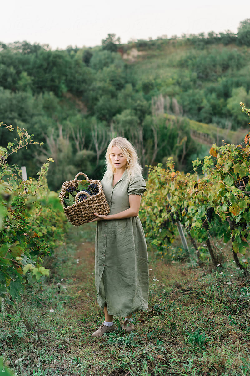 Woman looking at grape vines