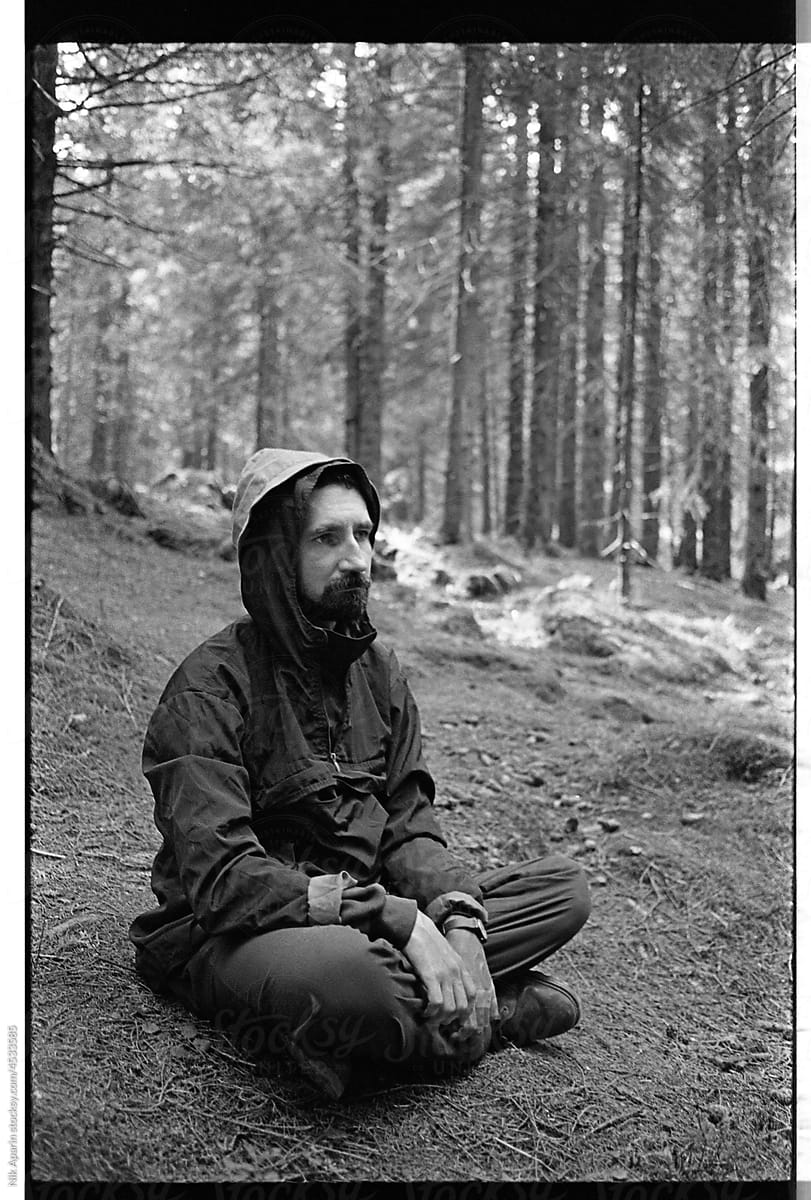 black and white portrait of a man in the forest
