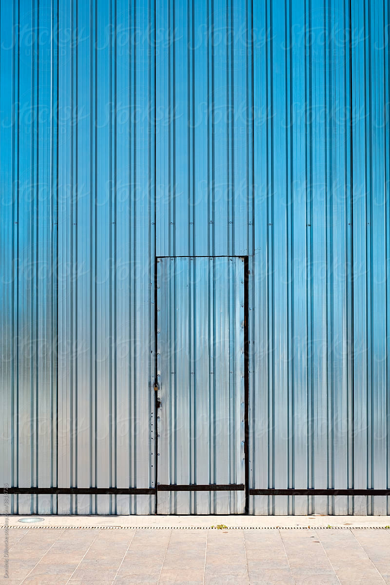 A door in a metal facade.