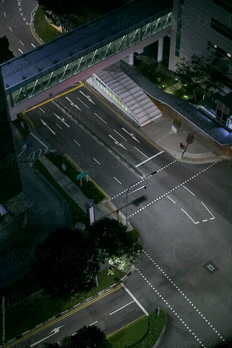 Empty road with intersection at night time