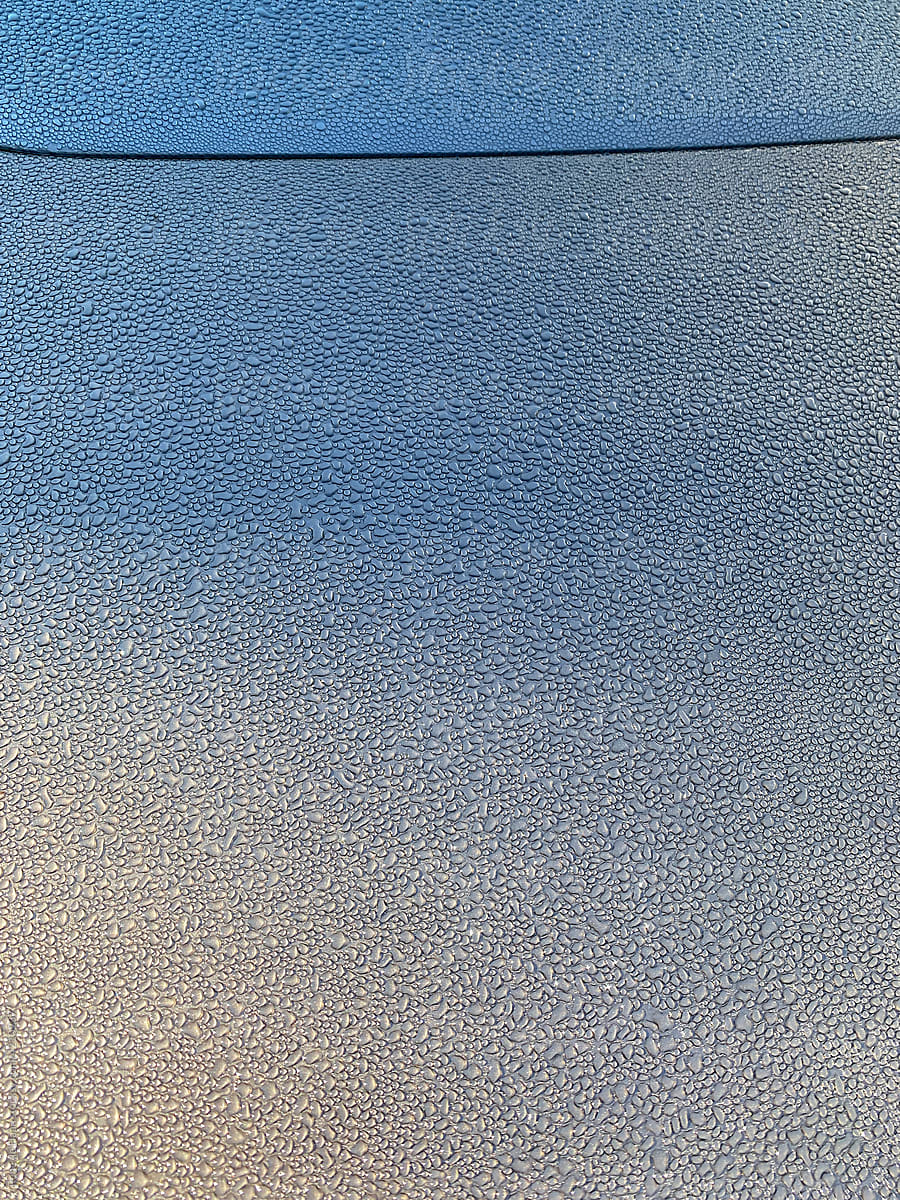 condensed waterdrops on car bonnet