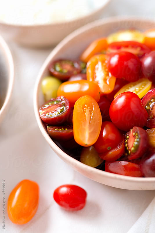 Halved cherry tomatoes in bowl