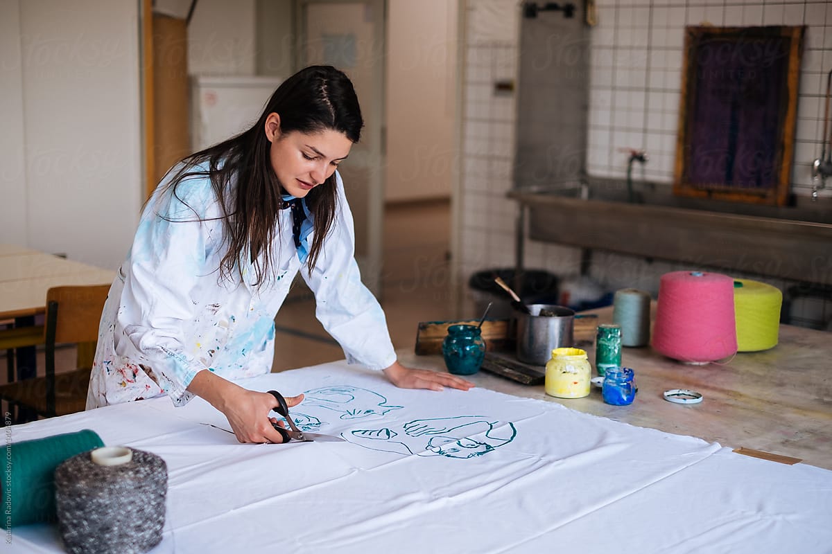Textile Designer Cutting Fabric