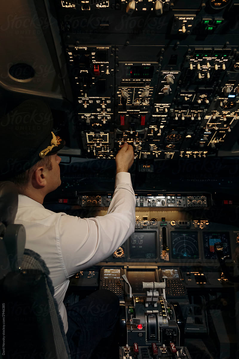 Captain of airplane in flight deck at work