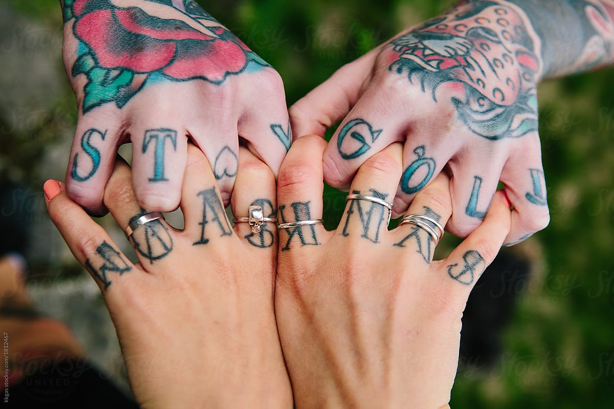 two hands together tattoo