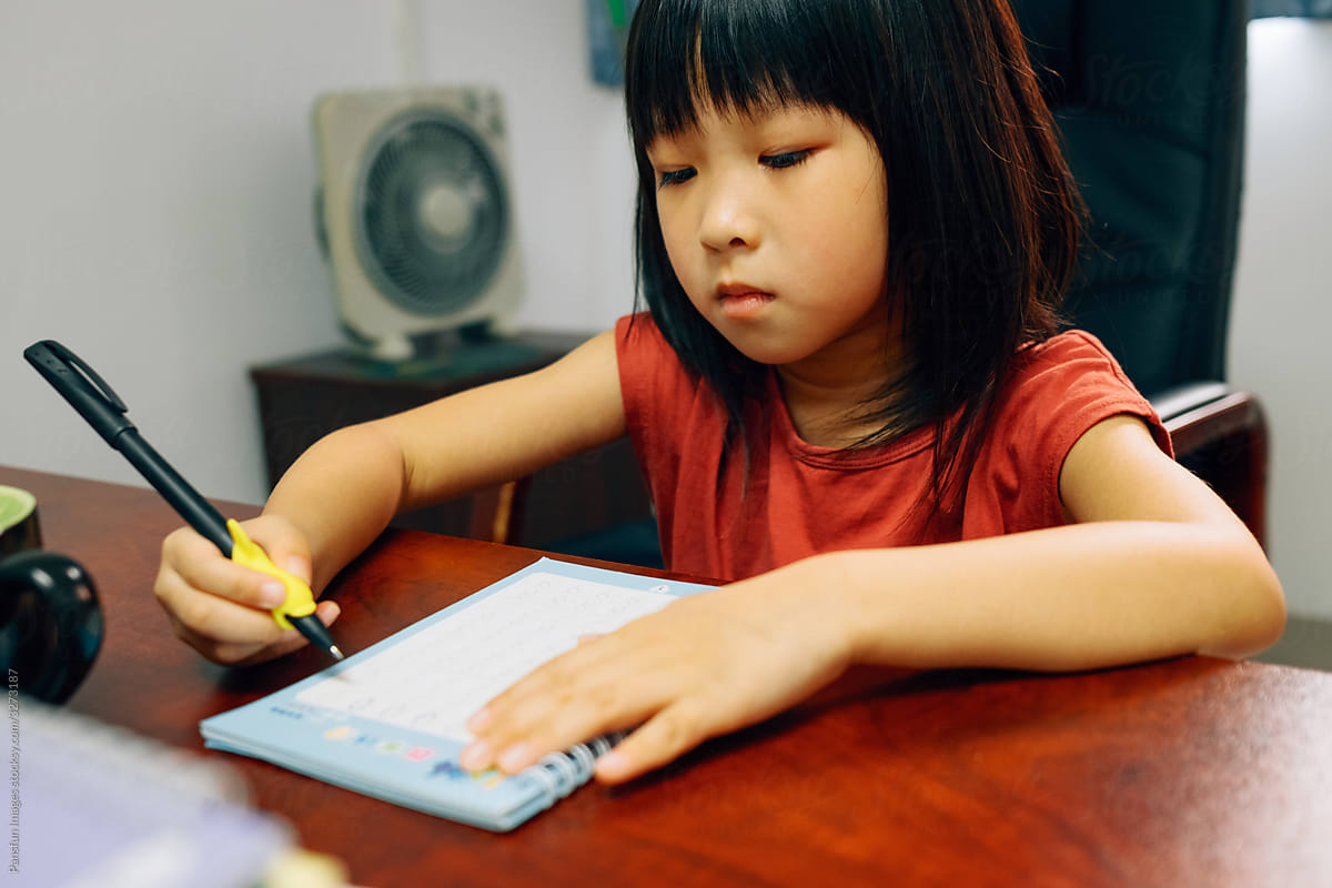 Chinese little girl learning to write