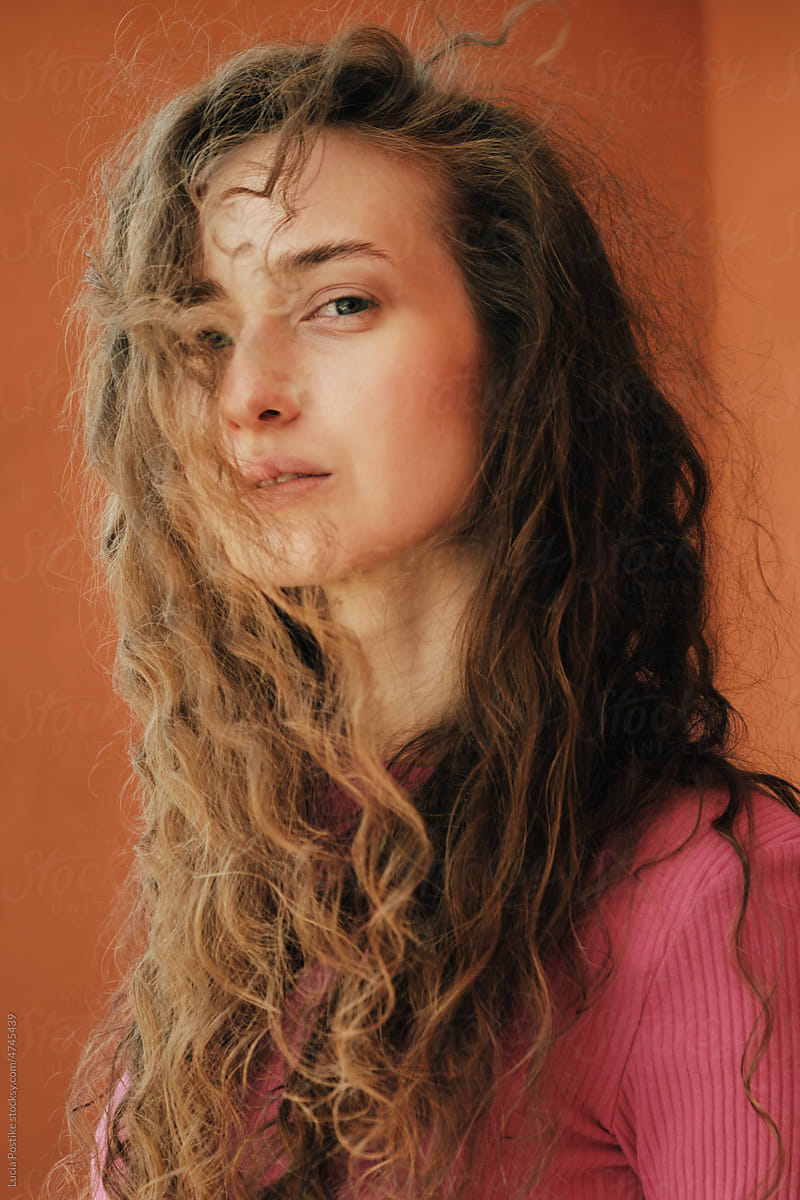 Portrait of a woman with curly flowing hair