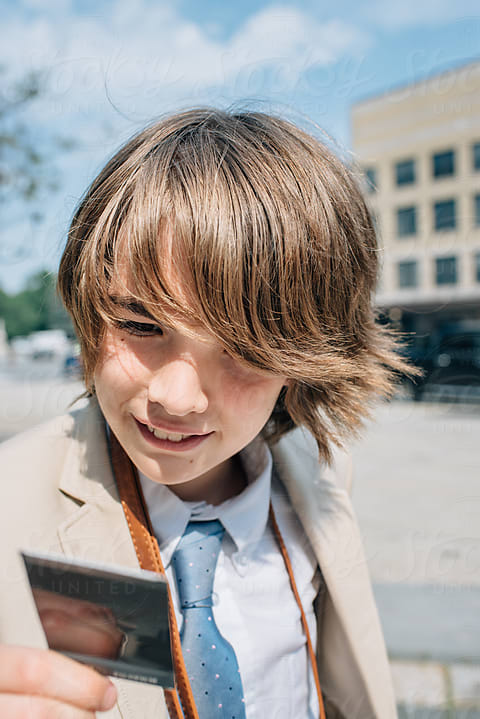 Teen Boy Looks In Mirror by Stocksy Contributor Cara Dolan - Stocksy