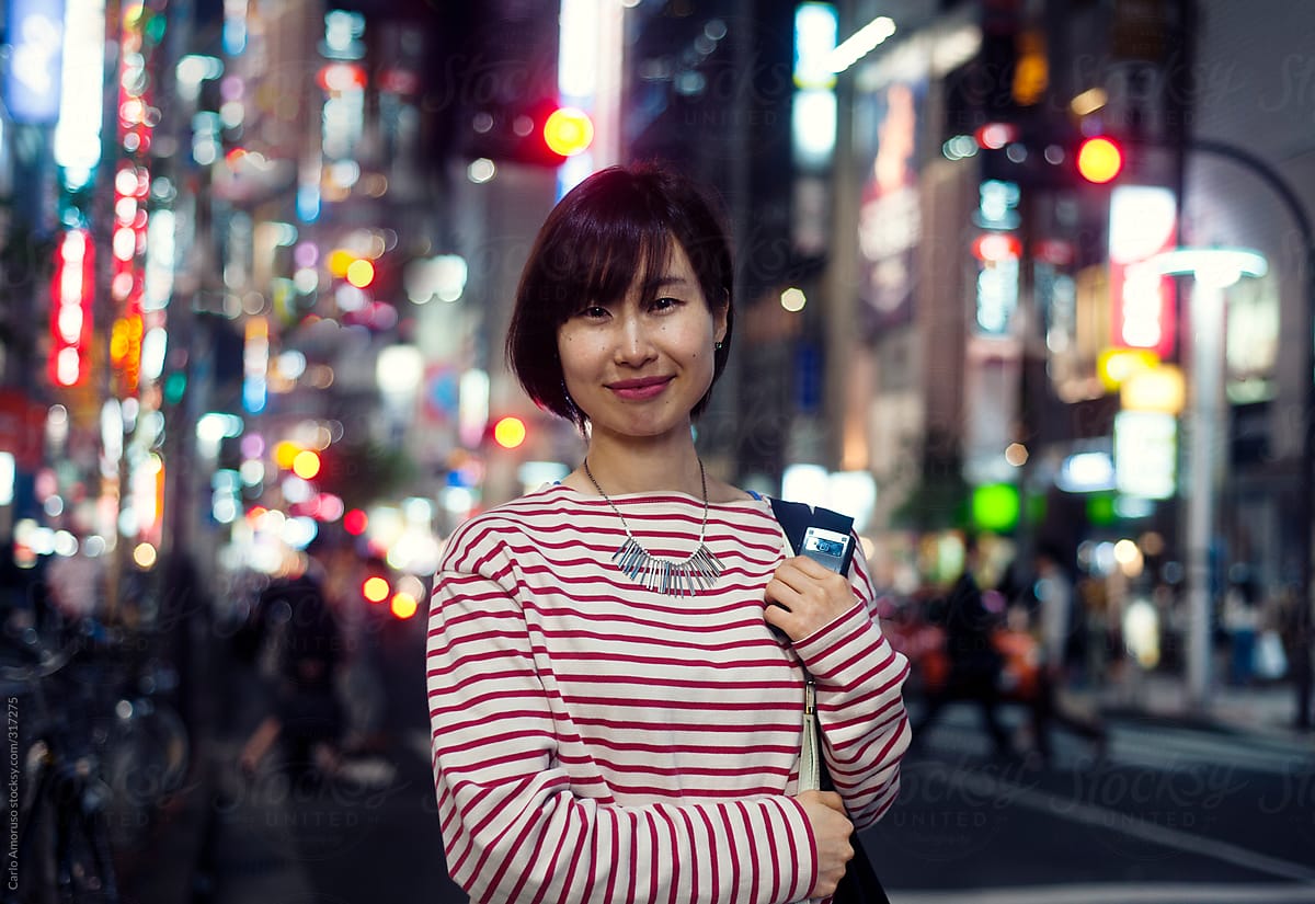 Potrait of young Japanese woman at night