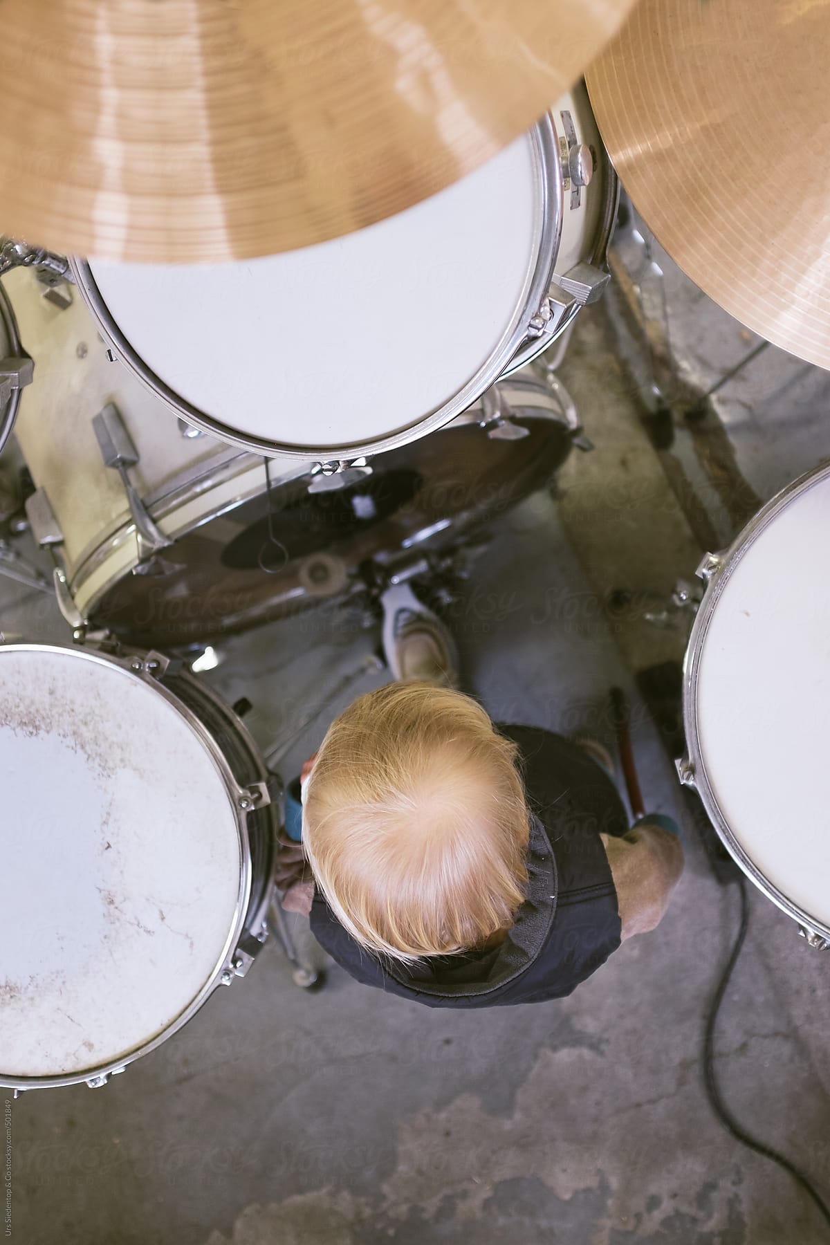 music-lesson-boy-at-drum-set-by-urs-siedentop-co