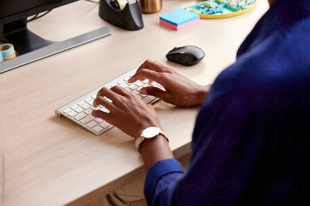 Cropped image of black woman using computer