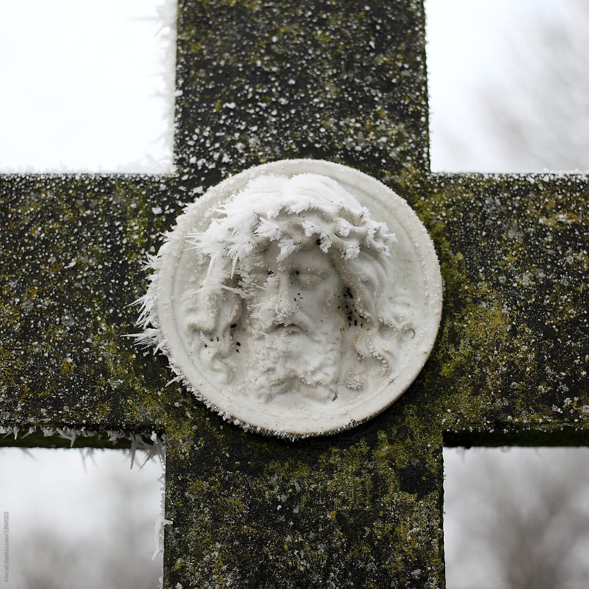 Frozen Jesus on a grave