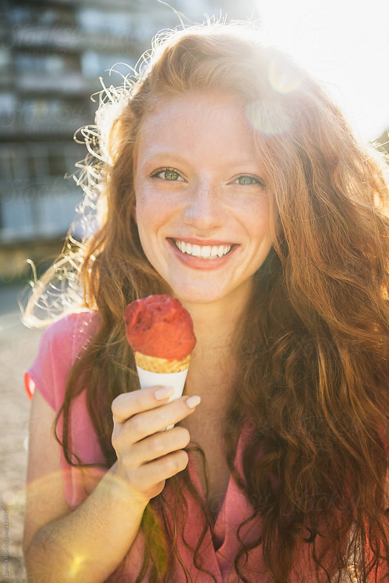 Smiling Woman Eating Ice Cream By Lumina Stocksy United