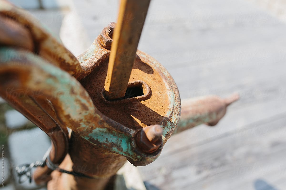 Old manual rusty metal water pump