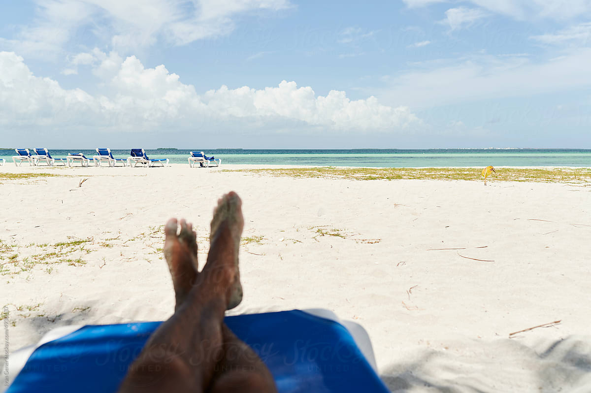 Man relaxing on a sandy beach