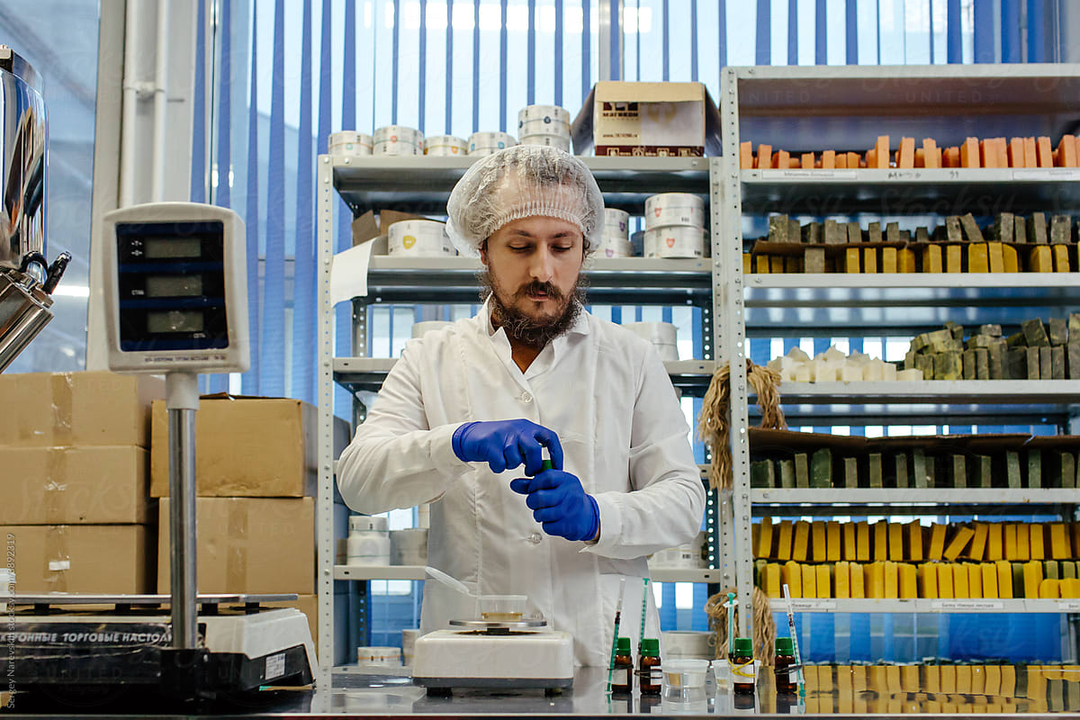 Cosmetic chemist creating products in laboratory