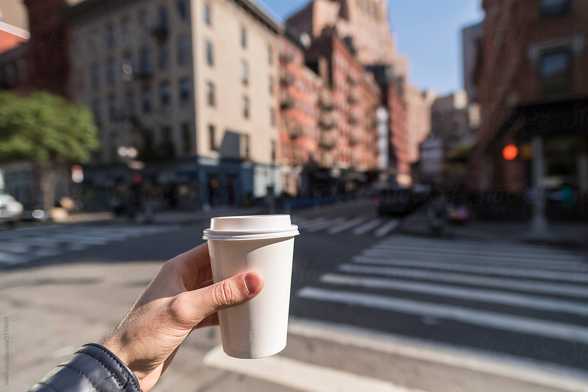 Man holding a coffee cup in New York City