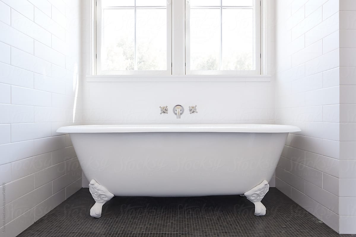  Clawfoot  bathtub in bathroom of modern design farmhouse by 