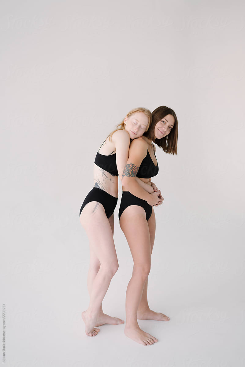 Diverse Girlfriends In Underwear Hugging by Stocksy Contributor