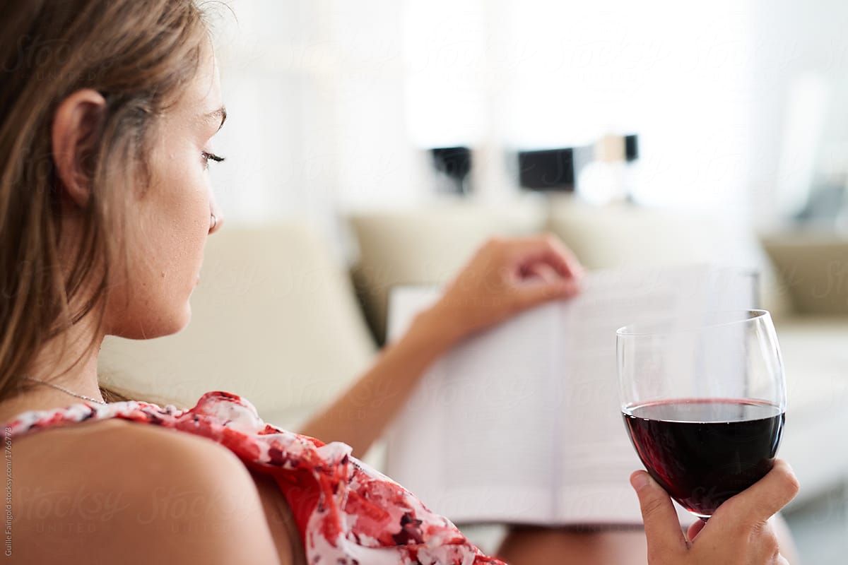 Chilling model with wine and book