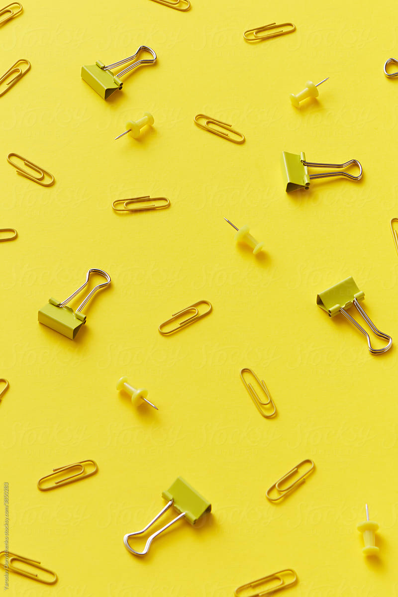 Scattered paper clips and pins