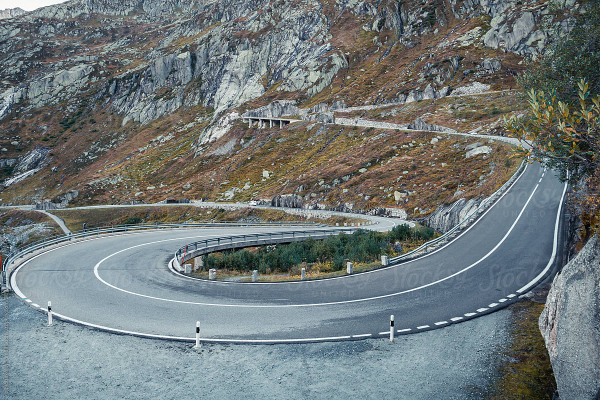 Hairpin bend on a mountain pass road in the alps.