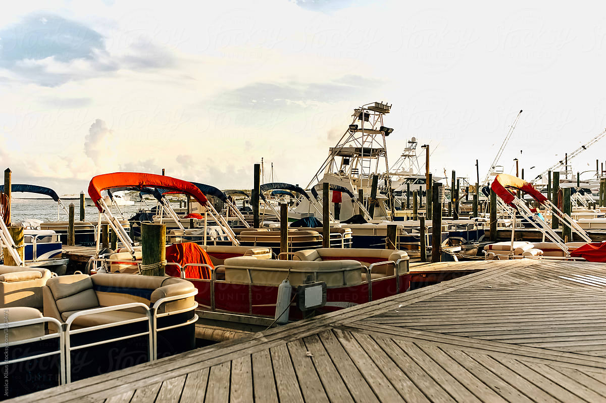 A colorful array of boats docked at the marina.