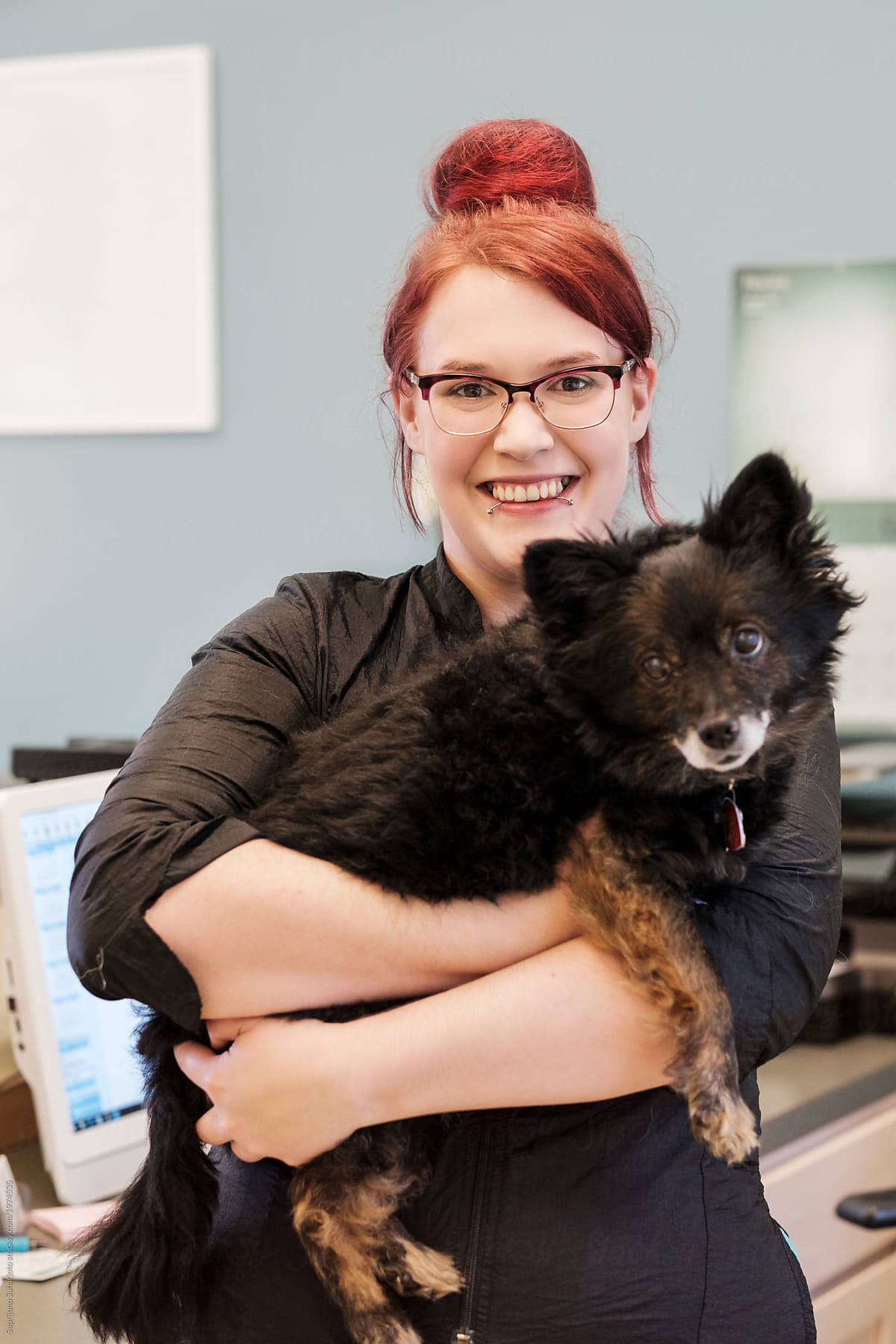 Small Business Pet Groomer Owner Posing With A Dog