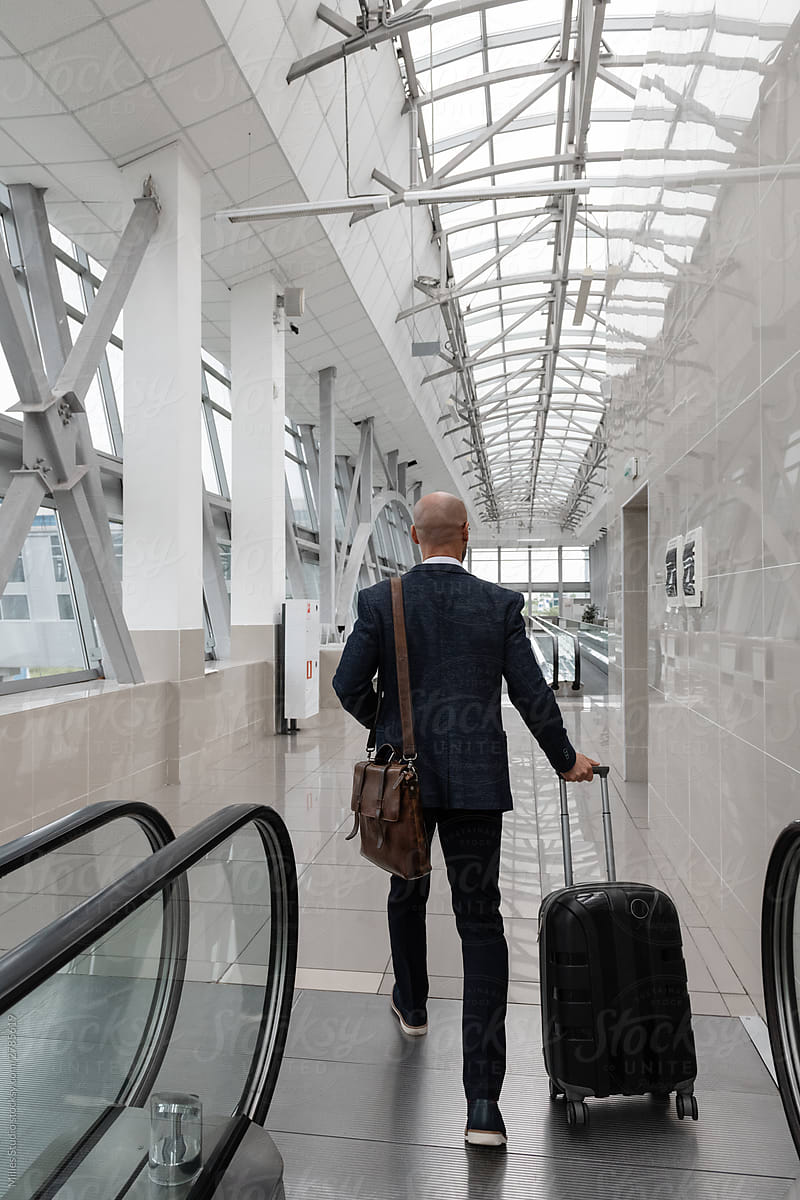 Unrecognizable businessman walking in airport corridor