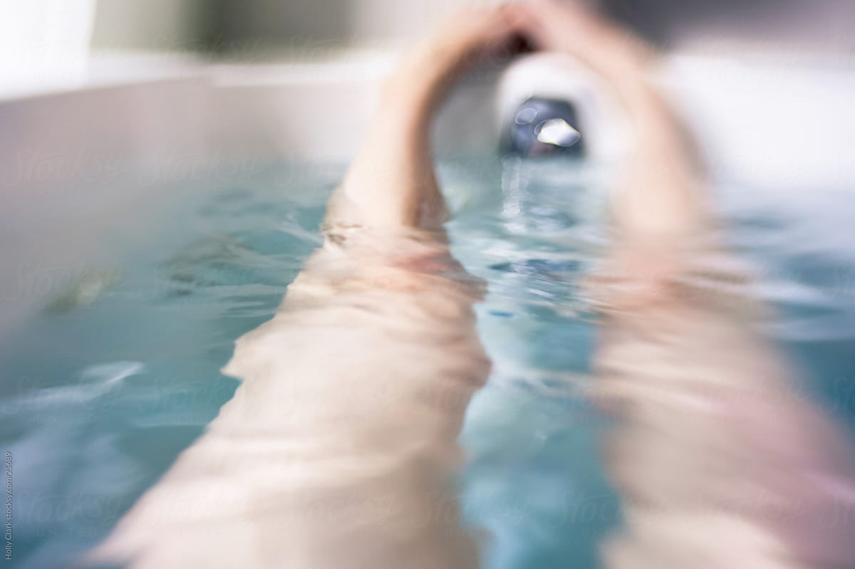 Dreamy abstract view of woman\'s legs in bathtub